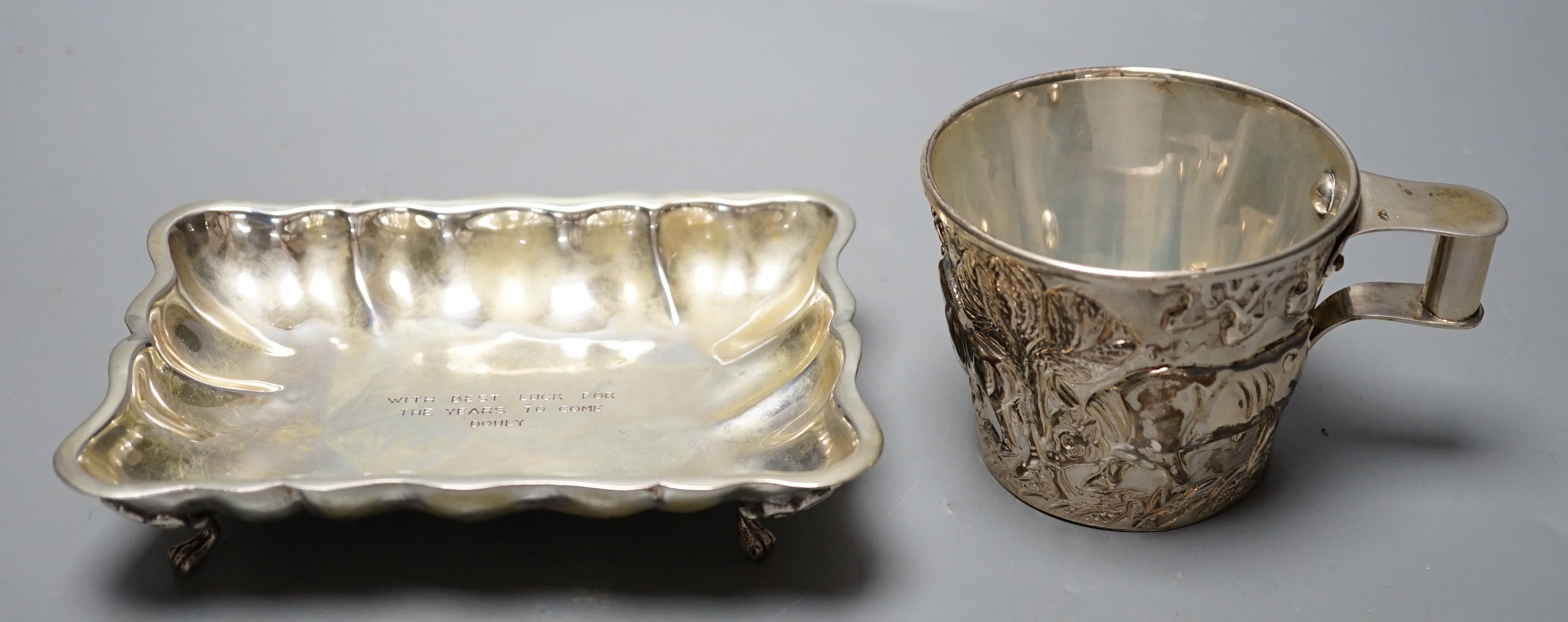 A Greek 900 standard white metal cup, embosses with cattle, height 66mm and a similar dish, gross 10.2oz.